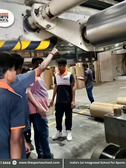 Students get a close look at the machinery in the paper factory, connecting classroom learning with real-world applications.