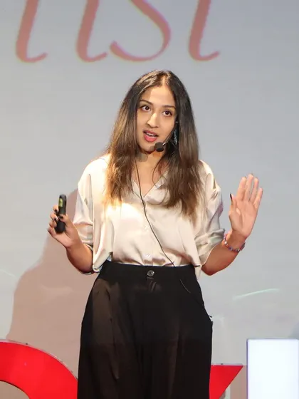 Explaining a key concept during my TEDx presentation. My goal is always to inspire others to find and follow their own creative voice.