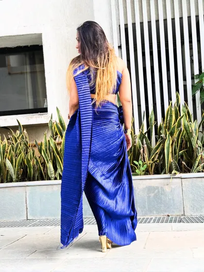 The back view of the pleated saree drape, showing the clean lines and modern silhouette.