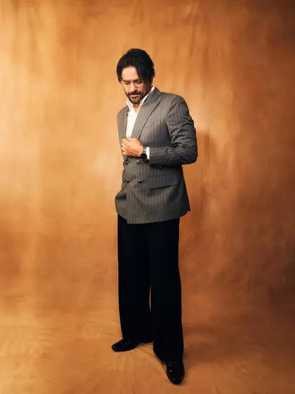 A candid-style shot that shows the beautiful drape and fit of the custom-tailored suit jacket.
