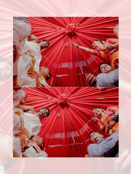 A unique low-angle shot looking up at the couple and their family during a wedding ritual, capturing the vibrant colors and joyful atmosphere.