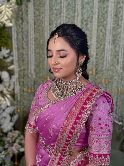 A close-up showing the soft, shimmery eye makeup and the flawless base that defines this elegant and traditional look.