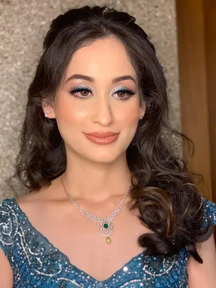 A close-up of the shimmery blue eye, which adds an element of surprise and fun to her engagement look.