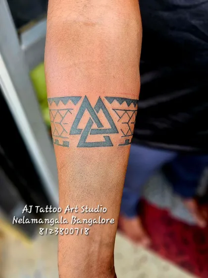 A geometric armband featuring interlocking triangles, a symbol with Norse origins.
