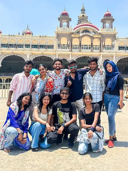 A duplicate of the group posing in front of the magnificent Mysore Palace. A must-see landmark and a highlight of our city tour.