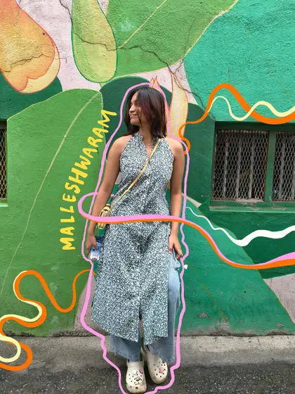 Posing in front of some cool street art in Malleshwaram, with my own doodles added on top.