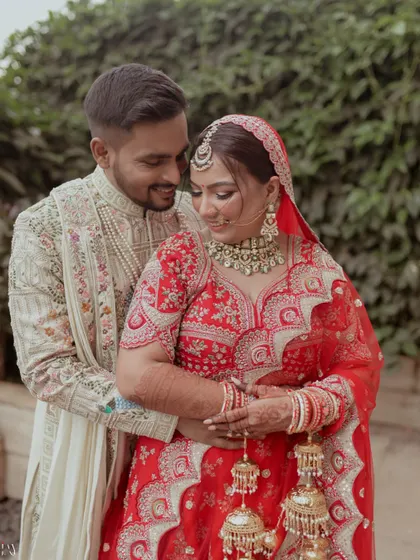 A close-up shot capturing the couple in a warm embrace on their wedding day.