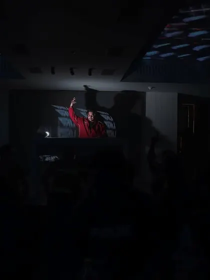 Another wide shot from the crowd's perspective, showing me commanding the stage under the lights.