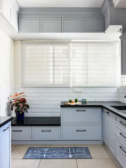 In this kitchen, I created a small, multifunctional nook with a bench seat. It's the perfect spot to have a morning coffee or take a short break while cooking.