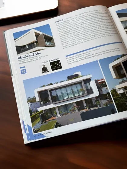 A look inside the "101 Top Indian Residences" book, where Residence 100 is featured for its unique contemporary design.