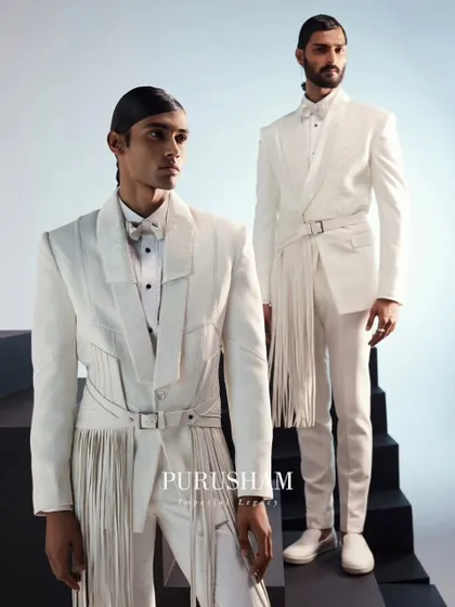 A full view of two modern white ensembles. These are designed to make a statement that transcends fleeting trends, exuding an aura of refined, contemporary elegance.