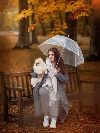 Even a little autumn rain can't stop us from creating magic. This charming shot of a girl and her Pomeranian under a clear umbrella is one of my favorites from the fall sessions.
