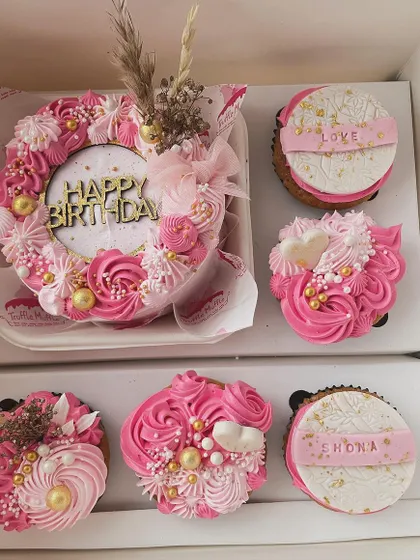 This is one of my bento hamper sets. It includes a mini 'Happy Birthday' cake and matching cupcakes, all in a beautiful pink and gold theme.