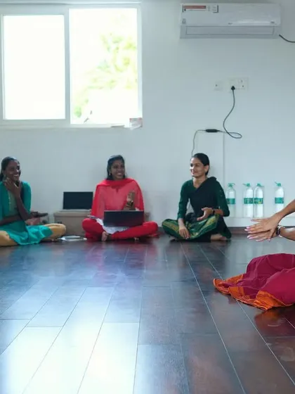 A moment of discussion and learning during a group session. The studio's quiet and focused environment is conducive to both practical instruction and theoretical lessons.