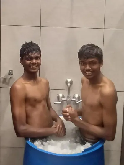 The ice bath is a crucial part of our professional recovery protocol. Here, two of our players smile through the cold after a tough training session.