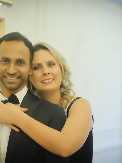 The colour version of a classic portrait. The warm lighting and soft focus create a romantic atmosphere, highlighting the couple's happy smiles during their indoor pre-wedding shoot.