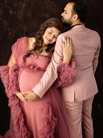 The way she rests her head on his shoulder says everything. I aim to capture these small gestures of love and support that define a couple's journey to parenthood.