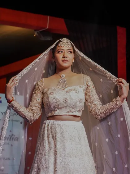 An elegant bridal lehenga designed and created by one of our students. The intricate detailing and classic silhouette were a highlight of the Memorabilia fashion show.