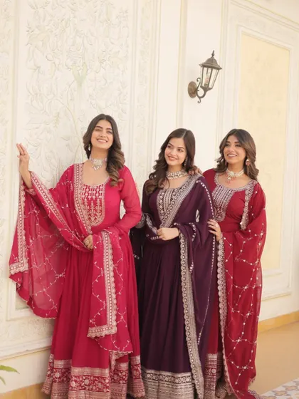 My Anarkali sets are designed to make you feel elegant and confident. This image shows a trio of designs in beautiful shades of red and wine, perfect for a coordinated bridesmaid look.