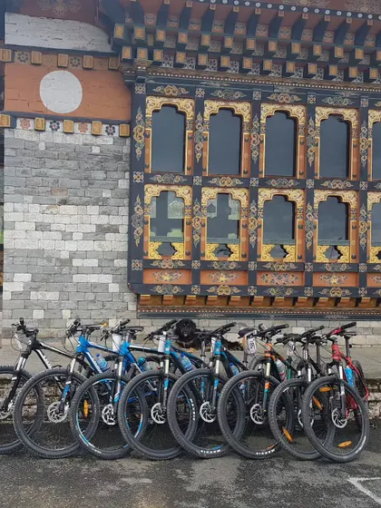 A lineup of our mountain bikes against the beautiful, traditional architecture of Bhutan. We make sure you have the right gear for the adventure.