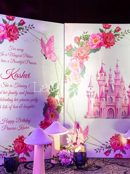 A beautiful storybook photo wall for Princess Kashvi's first birthday.
