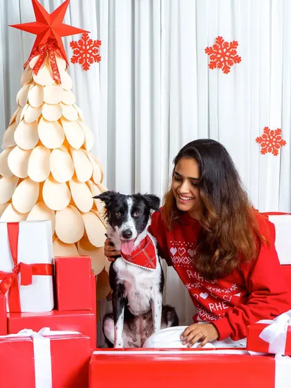 All the dog moms at our Christmas shoot thought their picture was the best, and they were all right! This woman and her dog look so festive and happy in our red-and-white holiday set.