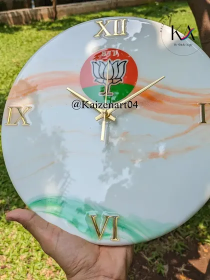 This custom wall clock was created with a specific logo and color scheme in mind. The tricolor waves of saffron, white, and green resin provide a dynamic background for the BJP logo, demonstrating how I can tailor designs for political or organizational branding.