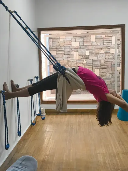 Let's choose to be grateful. This student is in a beautiful, deep backbend, fully supported by the yoga wall ropes. This allows for a safe and expansive opening of the heart.