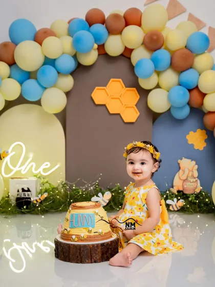 A "hunny" of a cake smash for a sweet little diva. We collaborated with amazing vendors to bring this Winnie the Pooh theme to life with custom balloons, cake, and props.