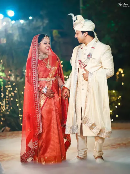 A beautiful portrait of the couple after their Varmala ceremony. The soft, dreamy lighting and their happy expressions make this a perfect wedding day memory.