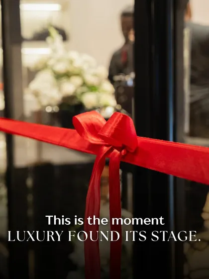 This is the moment. The simple, elegant red ribbon stands ready, a symbol of the beginning of a new chapter for Maybach. The blurred background with our floral decor hints at the luxurious experience waiting to be unveiled inside.