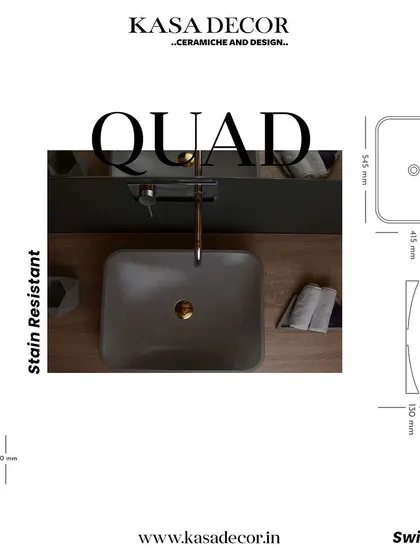 The 'Quad' concrete basin, featuring a rectangular shape with soft, curved interiors. This stain-resistant basin combines geometric form with functional elegance.