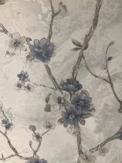 A close-up of the blue and grey flowers from the Chennai project, showing the watercolor effect of the design.