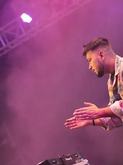 A moment of gratitude, clapping for the crowd's energy.