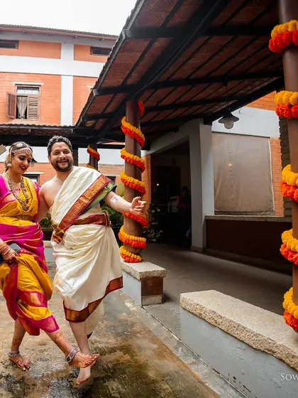 A fun, dynamic shot of the couple dancing and celebrating. Their energy and happiness are palpable, showcasing the festive spirit of their wedding day.