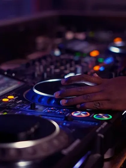 My hand on the jog wheel, getting ready to cue up the next track. This is a fundamental part of beatmatching and mixing live.