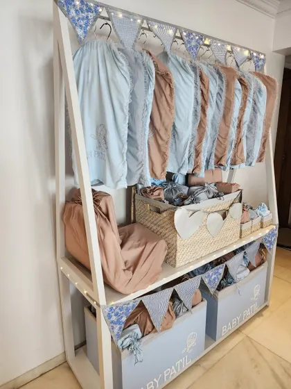 An angled view of the large wardrobe hamper for Baby Patil.