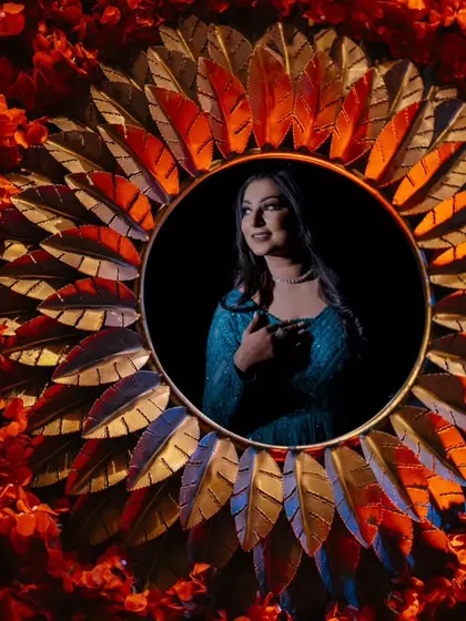 A creative portrait of a guest at a Mehendi or Sangeet night, framed by a beautiful floral mirror. We love finding artistic angles.