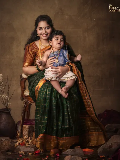 A powerful portrait of a mother and her baby in traditional North Karnataka attire. The image evokes a sense of history, strength, and enduring love.