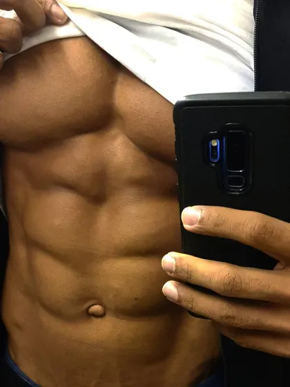 A close-up on the abdominal wall. Achieving this level of leanness is a science, combining targeted ab workouts with a precise nutrition plan.