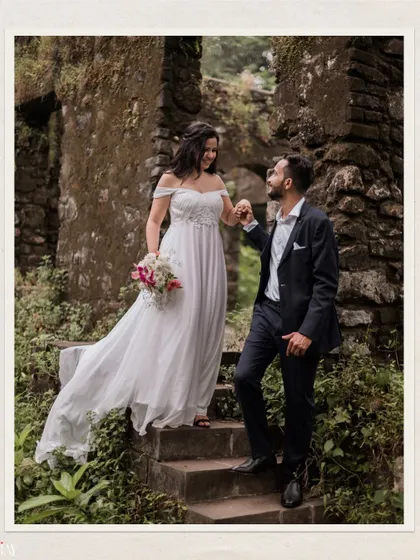 A classic romantic pose on the steps of an old ruin, creating a storybook pre-wedding image.