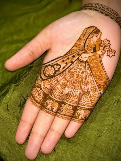 Another variation of the 'dulhan' design, this time with more intricate patterns on her skirt and fingers. It shows how a simple concept can be customized to be more detailed.