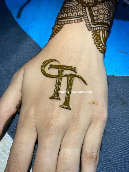 A bold and modern take on initials, this design features the letters 'TT' in a strong, graphic style.