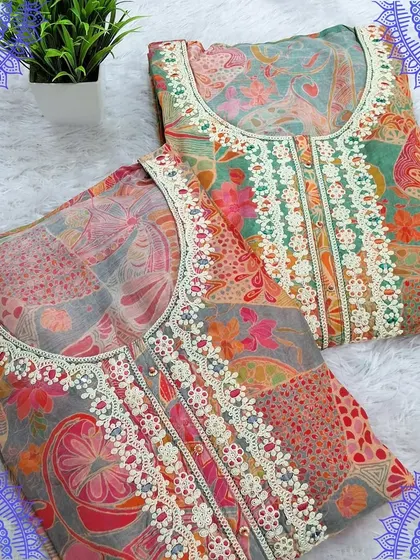 A beautiful set of two dress materials with digital prints and delicate lacework on the neckline. The soft colors and floral patterns make them ideal for daytime events.