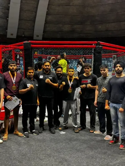 The MMA FitZone team standing proud in front of the octagon, showcasing the depth of our competitive roster.
