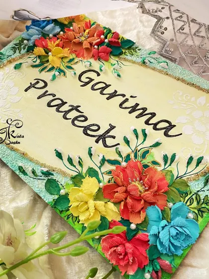 This custom nameboard for "Garima & Prateek" traveled all the way to Australia. I used a diamond-shaped board and arranged the flowers at the corners, leaving the center open for the names to be clearly visible.