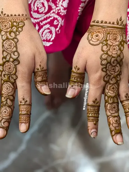 A beautiful rose vine design on the back of the hands. This is a classic and romantic choice for any occasion.
