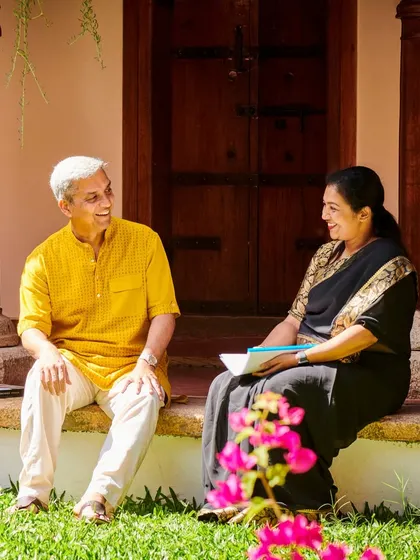 Our expert Ayurvedic doctors are the guides on your wellness journey. Here, two of our senior physicians share a moment of conversation on the steps of a heritage villa, embodying the personalized and compassionate care we provide to every guest.