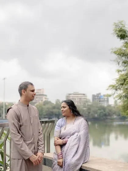 A calm, conversational moment between the couple, with the city and water in the background. Not every shot needs to be a big laugh; sometimes the quiet moments are just as powerful.