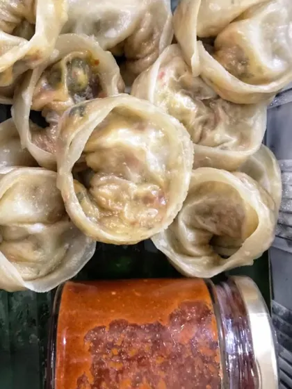 A serving of my juicy, flavor-packed chicken dim sum, paired with a spicy dipping sauce. These are a favorite from my Pan-Asian menu, ideal for when you are craving authentic oriental flavors at home.